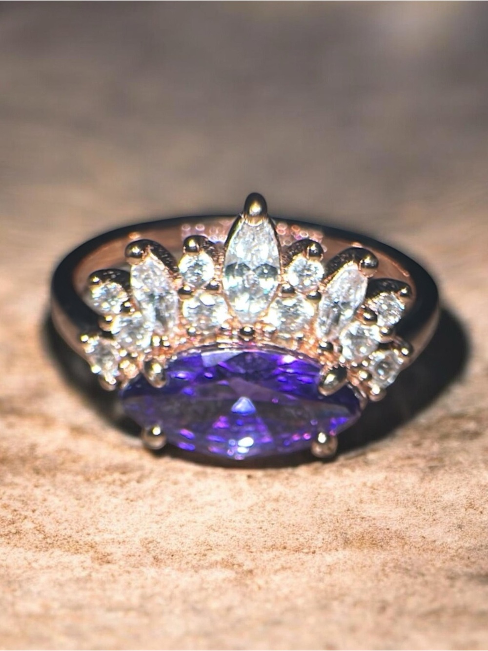 Bomb PartyGold Ring with Purple Marquise Center and Clear Halo Accents